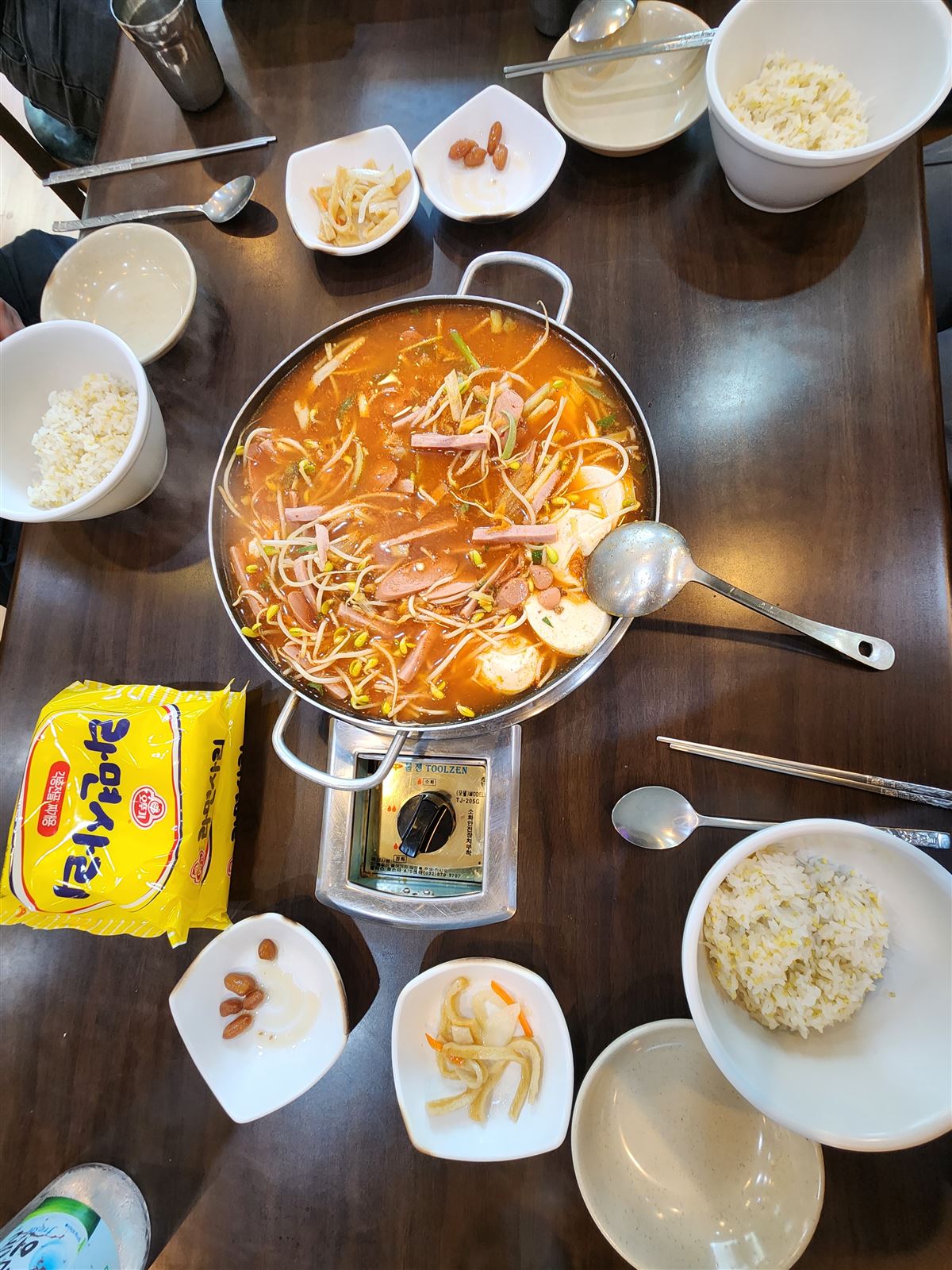 Budae jjigae army stew loaded with bean sprouts, ham and sausage in a red broth at Songtan Budae Jjigae, Myeongdong Seoul
